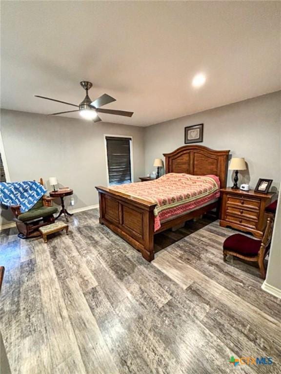 bedroom featuring hardwood / wood-style flooring and ceiling fan