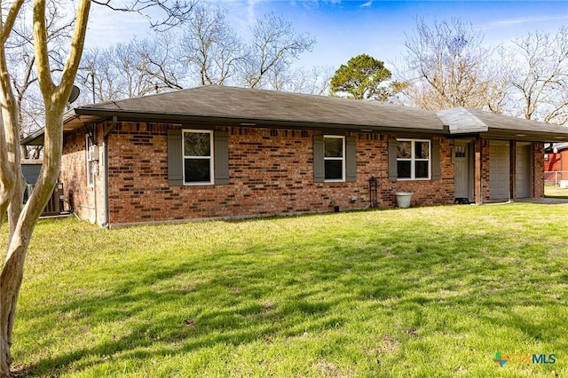 single story home featuring a garage and a front yard