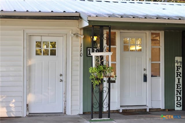 110 Crockett St, Port Lavaca, TX 77979 - property entrance featuring a metal roof