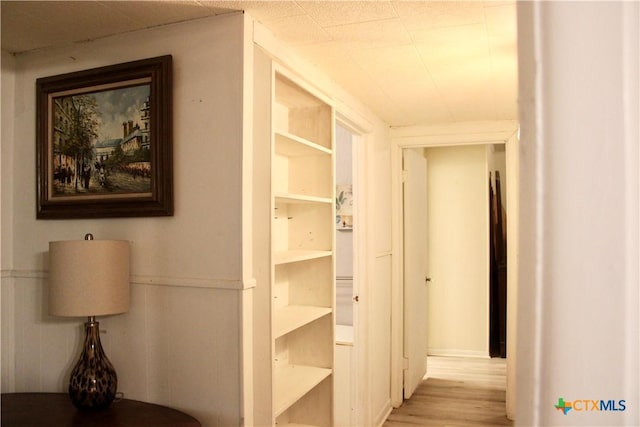 hall with light hardwood / wood-style floors