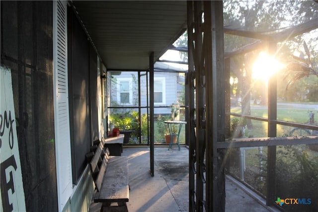 sunroom / solarium featuring a healthy amount of sunlight