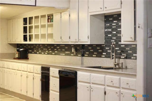 110 Crockett St, Port Lavaca, TX 77979 - kitchen with dishwasher, open shelves, light countertops, and tasteful backsplash