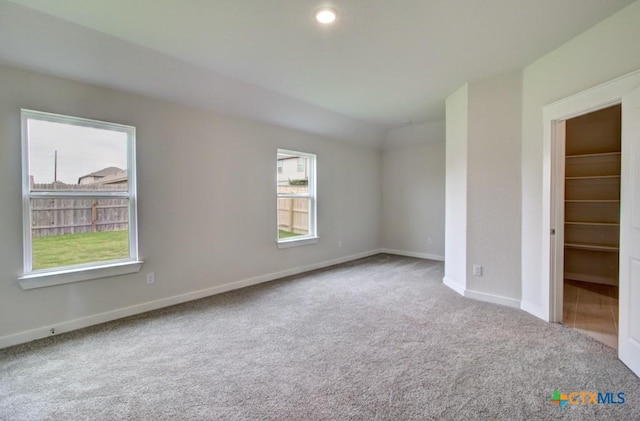 980 Gray Cloud Dr, New Braunfels, TX 78130 - unfurnished bedroom featuring carpet, baseboards, and a walk in closet