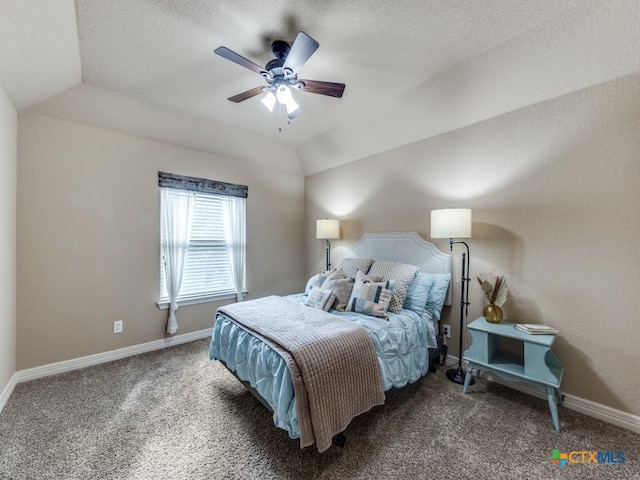 bedroom with ceiling fan, dark carpet, and lofted ceiling