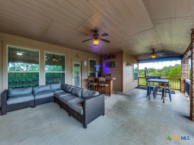 view of patio featuring an outdoor living space and ceiling fan