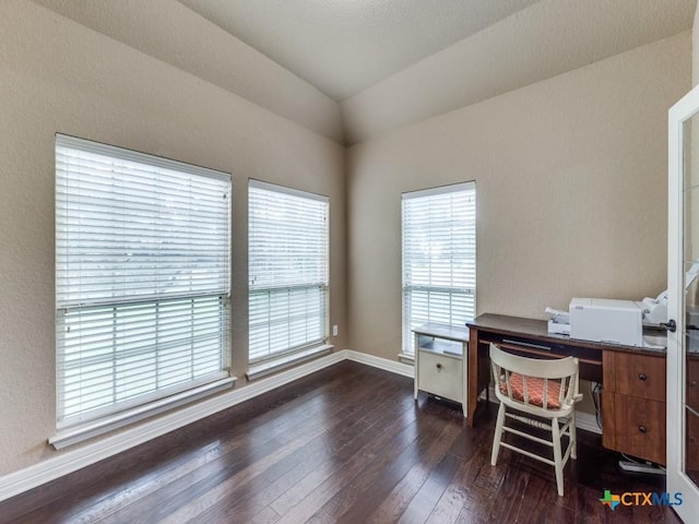 home office with vaulted ceiling and dark wood-type flooring