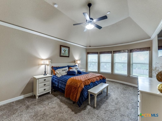 carpeted bedroom featuring ceiling fan, ornamental molding, and vaulted ceiling