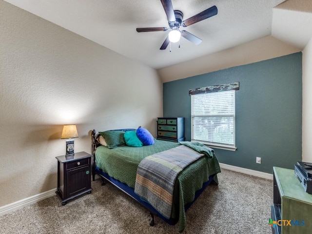 carpeted bedroom featuring ceiling fan and lofted ceiling