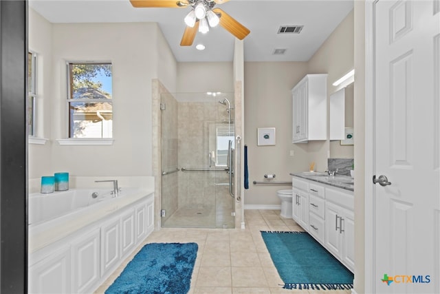 full bathroom with ceiling fan, vanity, shower with separate bathtub, tile patterned floors, and toilet