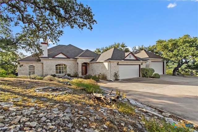 french country inspired facade with a garage