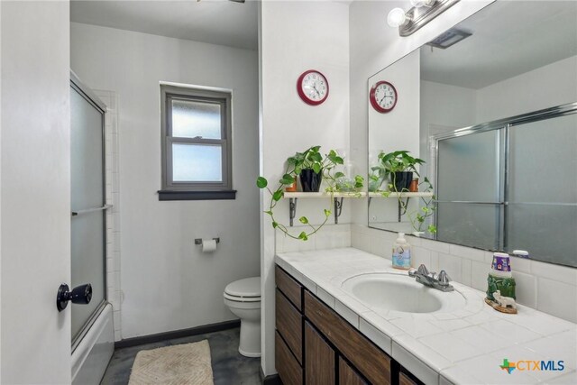 1035 Pine Meadow Rd, Seguin, TX 78155 - full bath with concrete floors, baseboards, toilet, vanity, and decorative backsplash