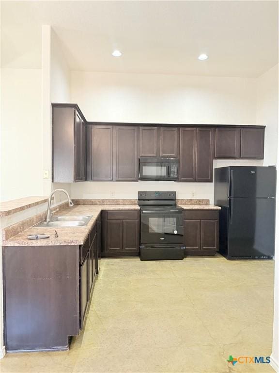 209 Anne Louise Dr, New Braunfels, TX 78130 - kitchen featuring black appliances, dark brown cabinets, light countertops, and a sink