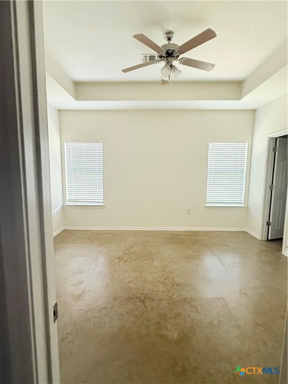 209 Anne Louise Dr, New Braunfels, TX 78130 - unfurnished room with baseboards, concrete flooring, and ceiling fan