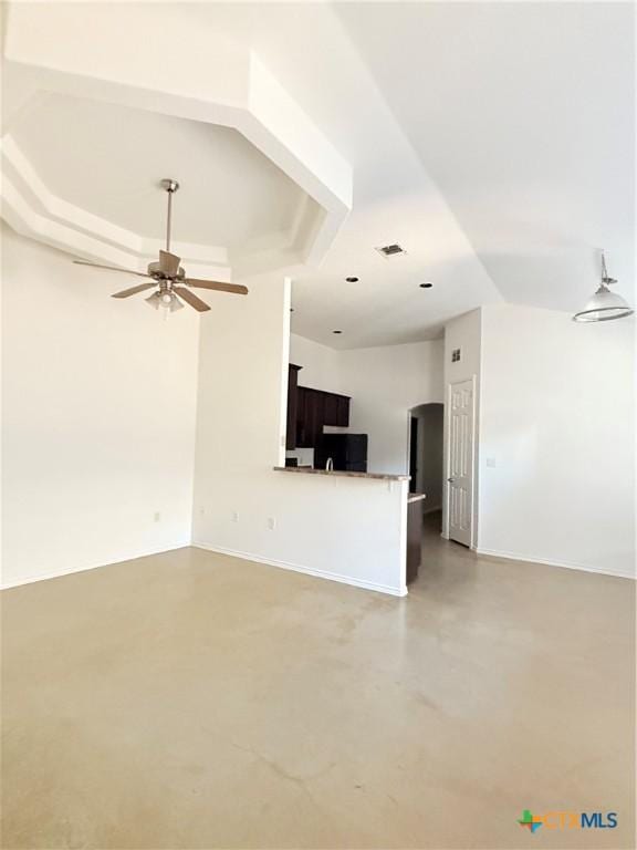 209 Anne Louise Dr, New Braunfels, TX 78130 - unfurnished living room with arched walkways, visible vents, concrete flooring, and ceiling fan