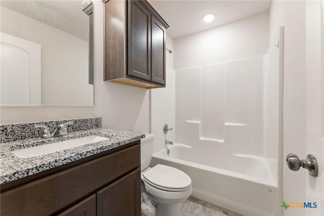 full bathroom featuring shower / bathtub combination, vanity, and toilet