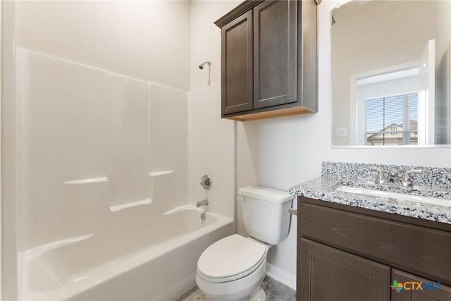 full bathroom featuring vanity, bathtub / shower combination, and toilet