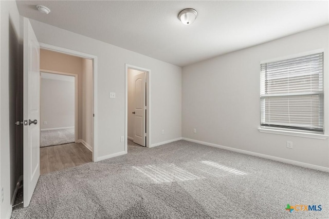 unfurnished bedroom with carpet