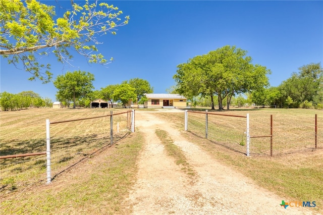395 Dale Ln, Dale, TX 78616 - view of dirt / gravel road featuring a view of countryside and a gated entry