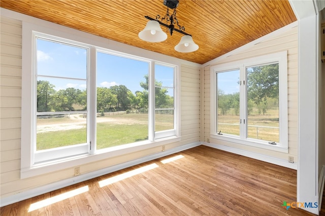 395 Dale Ln, Dale, TX 78616 - unfurnished sunroom featuring wood ceiling, lofted ceiling, wood finished floors, and wood walls