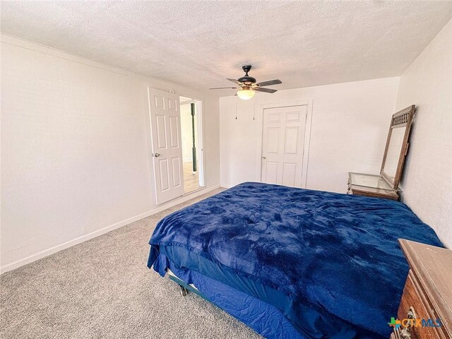 3007 Meadowlane St, Victoria, TX 77901 - carpeted bedroom with a ceiling fan, a textured ceiling, and baseboards