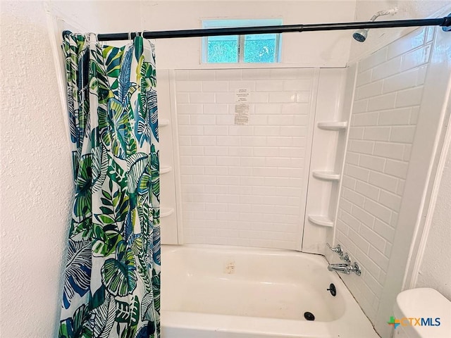 3007 Meadowlane St, Victoria, TX 77901 - full bathroom with shower / bath combo with shower curtain, toilet, and a textured wall