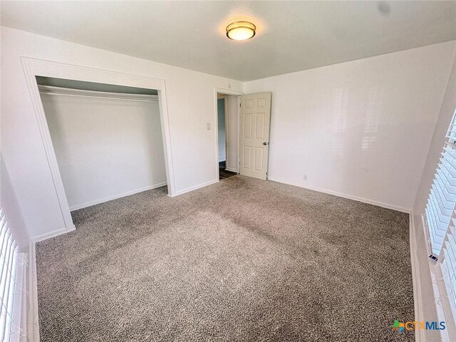 3007 Meadowlane St, Victoria, TX 77901 - unfurnished bedroom featuring carpet flooring, a closet, and baseboards