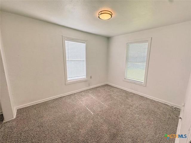 3007 Meadowlane St, Victoria, TX 77901 - carpeted empty room with baseboards