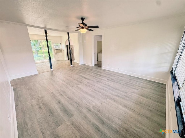 3007 Meadowlane St, Victoria, TX 77901 - empty room featuring a ceiling fan, wood finished floors, baseboards, and a textured ceiling