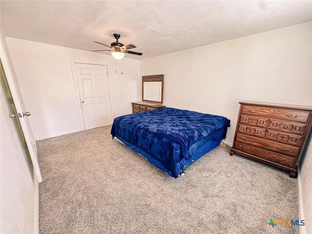 3007 Meadowlane St, Victoria, TX 77901 - carpeted bedroom with a textured ceiling, ceiling fan, and baseboards
