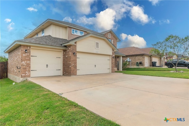 view of front of property featuring a garage and a front lawn