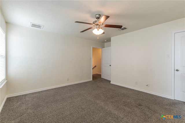 carpeted empty room with ceiling fan