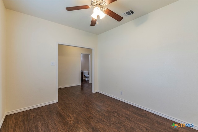 unfurnished room featuring dark hardwood / wood-style flooring and ceiling fan