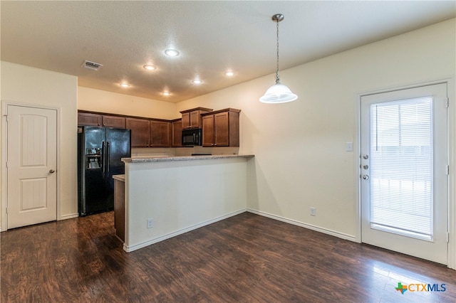 kitchen with kitchen peninsula, black appliances, dark hardwood / wood-style floors, and decorative light fixtures