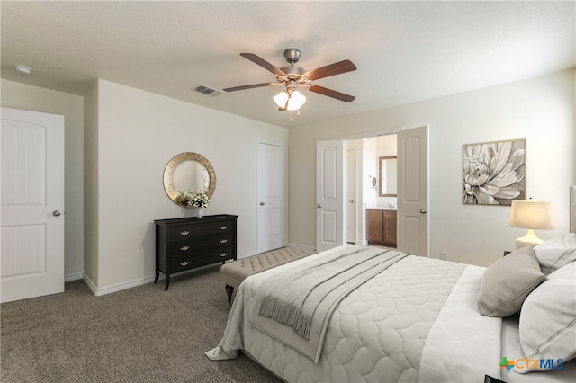 carpeted bedroom featuring a textured ceiling and ceiling fan