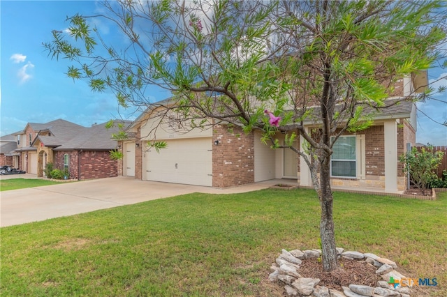 view of front of home with a garage and a front lawn