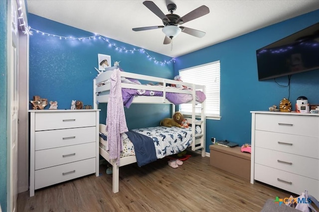 bedroom featuring ceiling fan and wood-type flooring