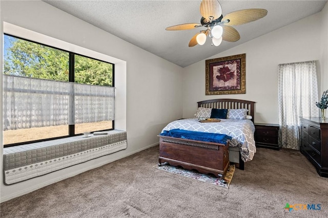 bedroom featuring multiple windows, carpet floors, lofted ceiling, and ceiling fan