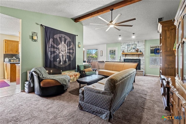 living room with a brick fireplace, light carpet, and a textured ceiling