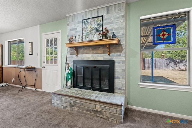 carpeted living room with a fireplace and a textured ceiling