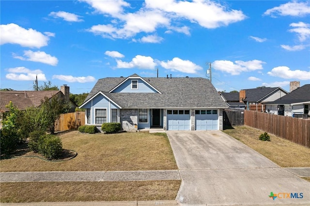 view of front facade with a garage and a front lawn