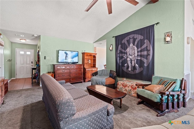 living room featuring ceiling fan, lofted ceiling, light carpet, and a textured ceiling