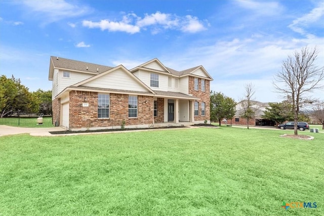 back of property with a garage and a yard