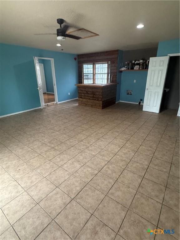 1309 W Ln, Killeen, TX 76549 - unfurnished living room featuring a ceiling fan, baseboards, and recessed lighting