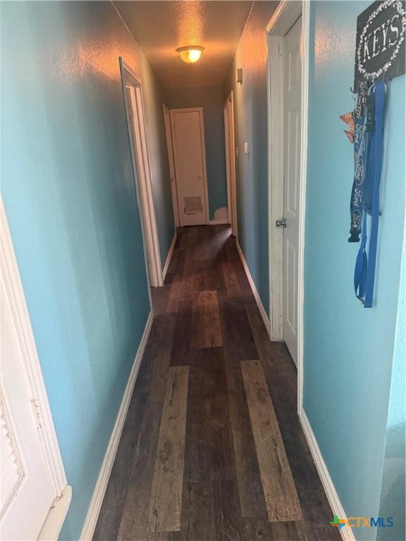 1309 W Ln, Killeen, TX 76549 - hall featuring wood finished floors and baseboards
