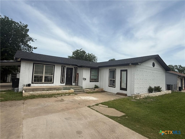 1309 W Ln, Killeen, TX 76549 - single story home featuring brick siding, a front lawn, and cooling unit