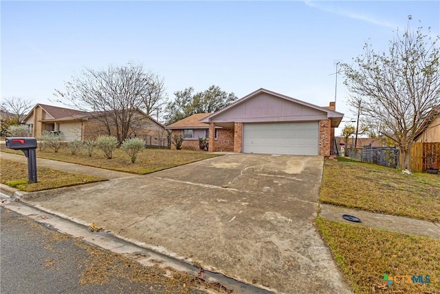 single story home with a garage and a front lawn