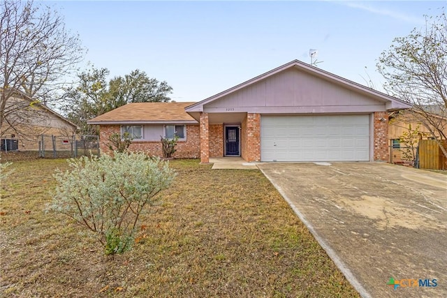 ranch-style house featuring a garage