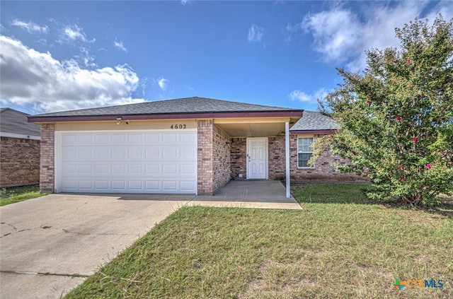 ranch-style home with a garage and a front lawn