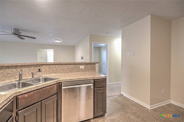 kitchen featuring a textured ceiling, dark brown cabinets, sink, stainless steel dishwasher, and ceiling fan