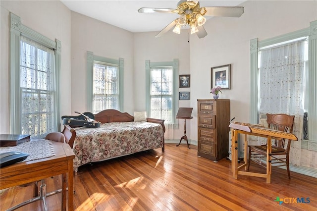 bedroom featuring ceiling fan and light hardwood / wood-style flooring